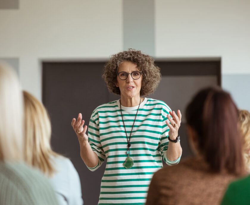 Woman Sharing Experience During Seminar