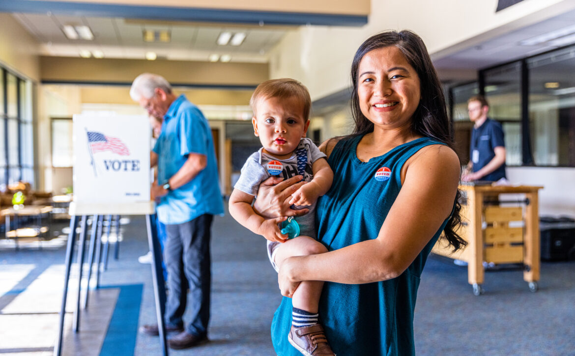 Filipino Woman and her baby boy after voting in an American Election