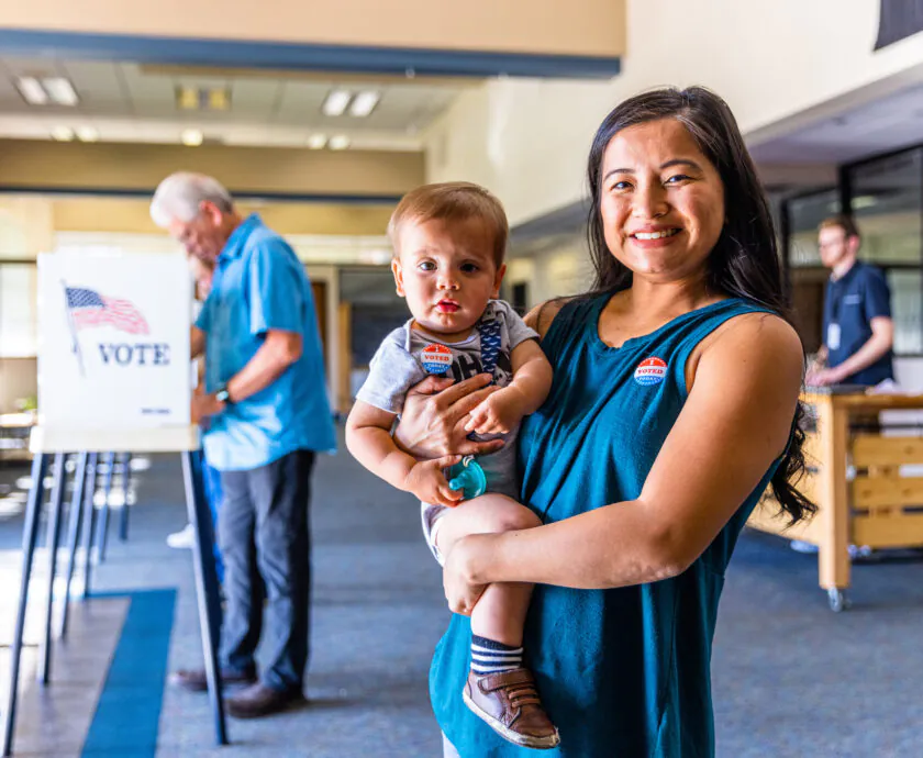 Filipino Woman and her baby boy after voting in an American Election